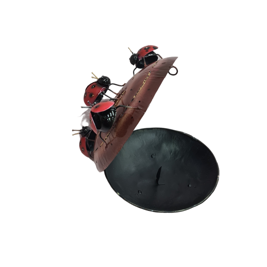 Red bugs on a brown mosquito coil holder