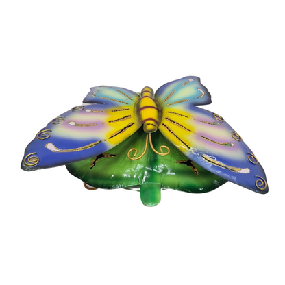Mosquito coil holder blue butterfly on green leaf
