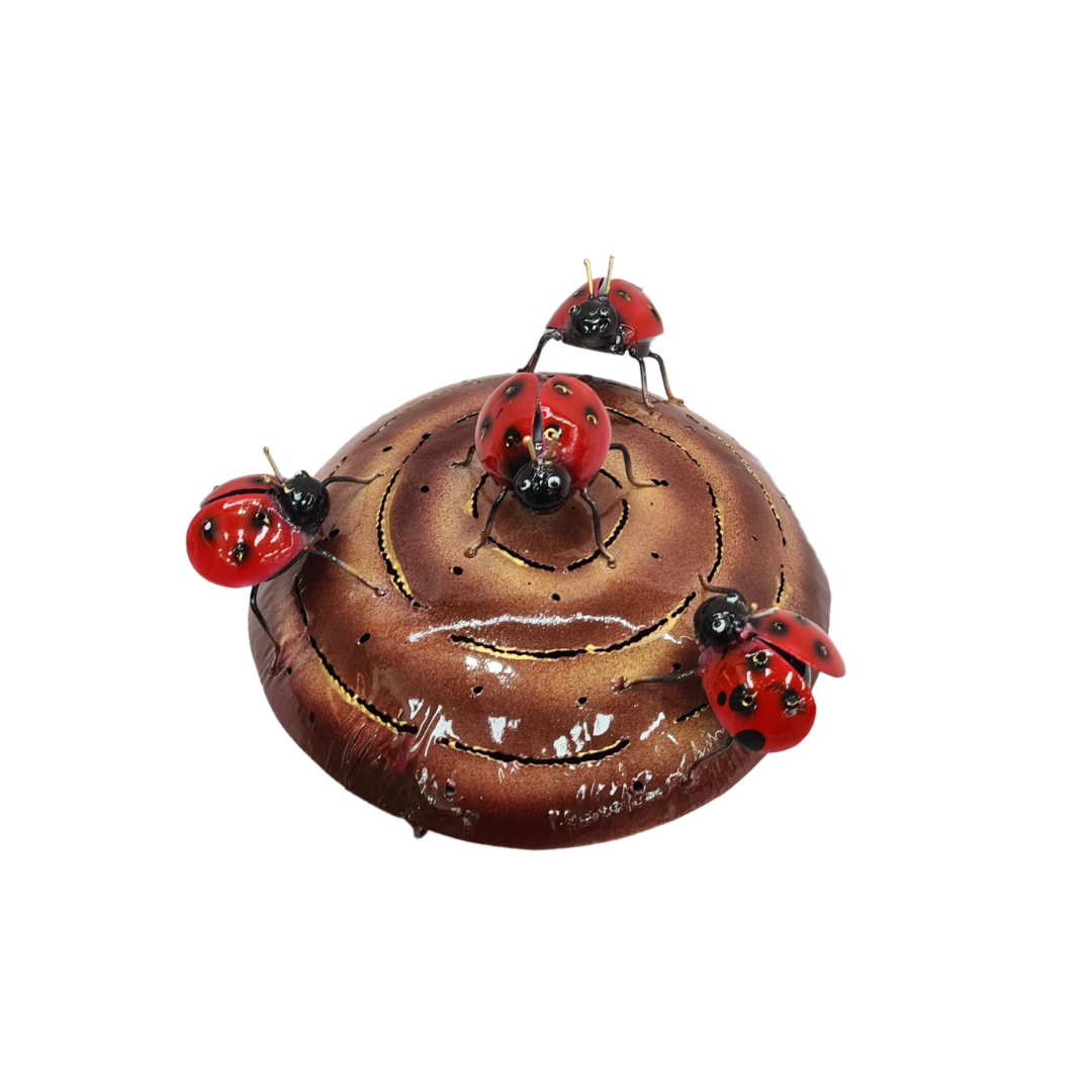 Red bugs on a brown mosquito coil holder