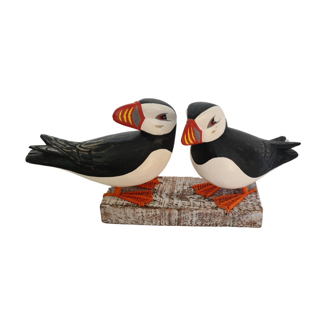 Puffin pair standing on log 38 cm long